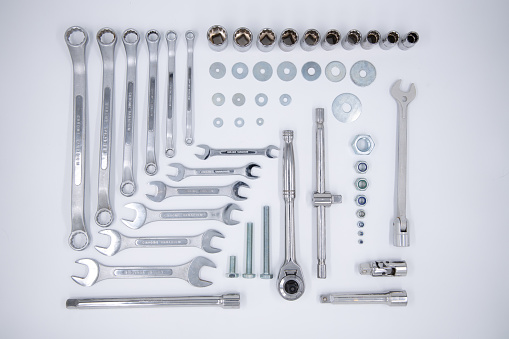 Knolling arrangement of a collection of sockets, spanners, wrench, nuts and washers