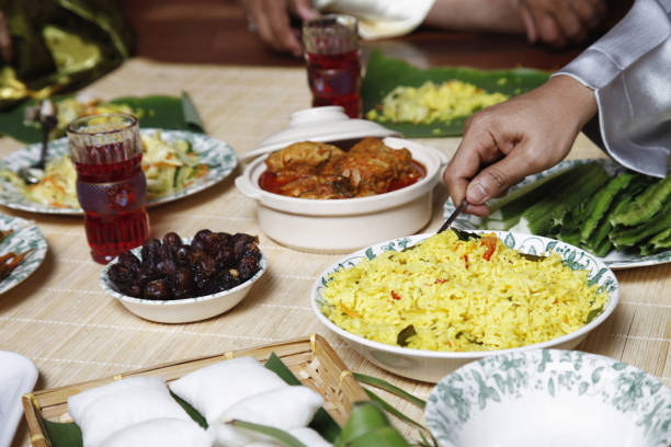 istock Man scooping nasi briyani,focus on food in the foreground 1264471964
