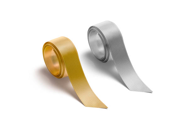 istock Blank gold and silver rolled silk ribbon mockup, side view 1264472285