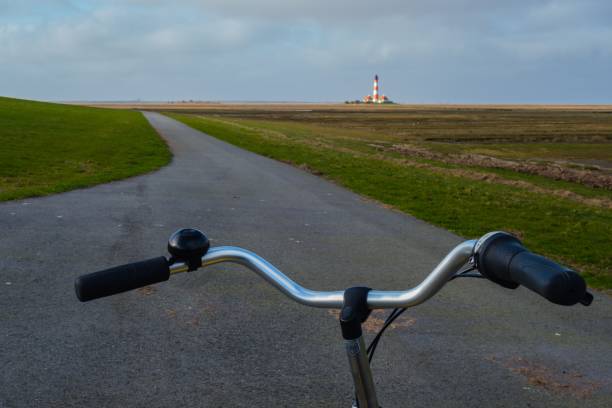 istock With the Bicycle to Lighthouse Westerhever Germany 1264478272