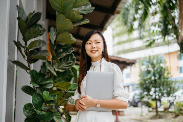 Young asian businesswoman going to work