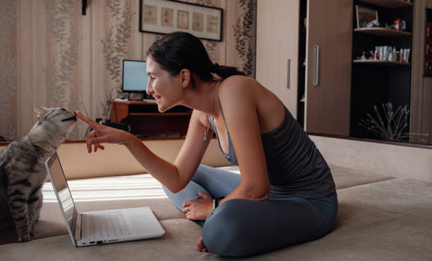 istock Young attractive smiling woman practicing yoga, sitting in Half Lotus exercise 1264482241