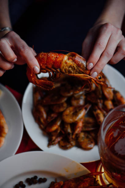 istock a candlelit dinner with shrimps and rock lobster and beer 1264482333