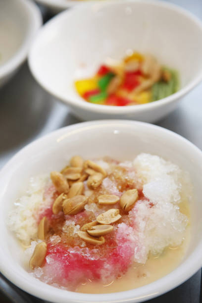 istock Shaved ice with coloured syrup and condensed milk topped with peanuts 1264482393
