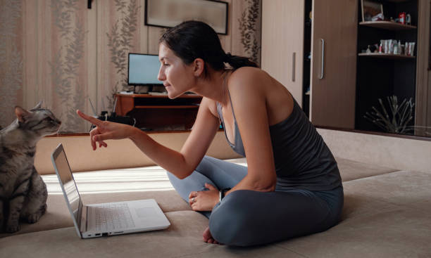 istock Young attractive smiling woman practicing yoga, sitting in Half Lotus exercise 1264482531