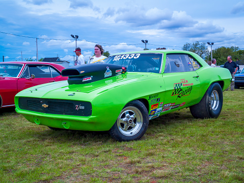 Truro, Nova Scotia, Canada - June 5, 2010 : 1969 Chevrolet Camaro Z28 drag racer at local car show in Truro, Nova Scotia, Canada. A lady stands near to the car.