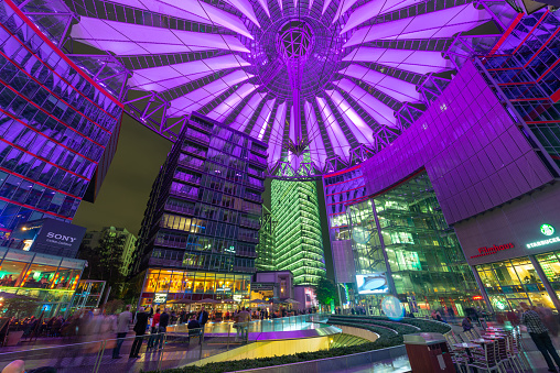 Berlin, Germany - September 20, 2013: Visitors enjoy Sony Center at night. The center is a public space located in the Potsdamer Platz financial district.