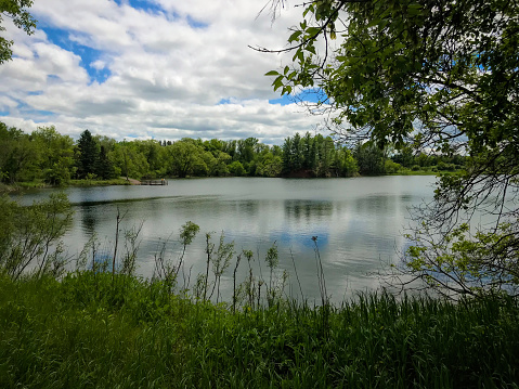 Beautiful lake scene taken along a walking trail at Strawberry Lake Park in Norway, Michigan in the Upper Peninsula of Michigan, USA.