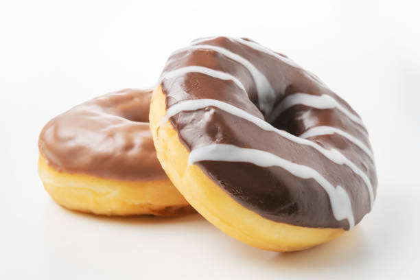 istock Delicious chocolate donuts on a white table. Food concept. 1264496834