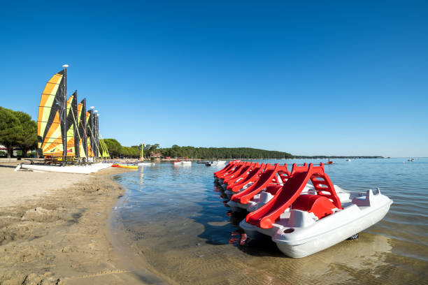 Lake Carcans and Hourtin in Maubuisson in the Médoc View of the largest freshwater lake in France in Maubuisson in Gironde, France pedal boat stock pictures, royalty-free photos & images