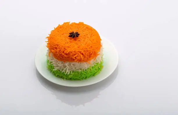 Photo of Indian Tricolor or Tiranga Rice for indian Republic and Independence day, served in a ceramic plate