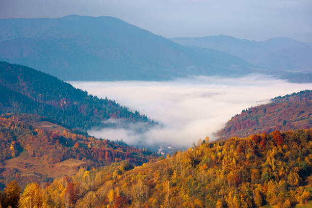 istock autumn sunrise in mountains 1264505763