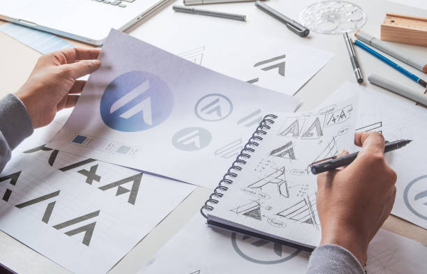 istock Graphic designer creative design sketch drawing logo Trademark brand Workspace 1264505769