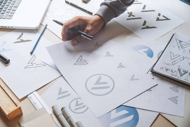 istock Graphic designer creative design sketch drawing logo Trademark brand Workspace 1264505770