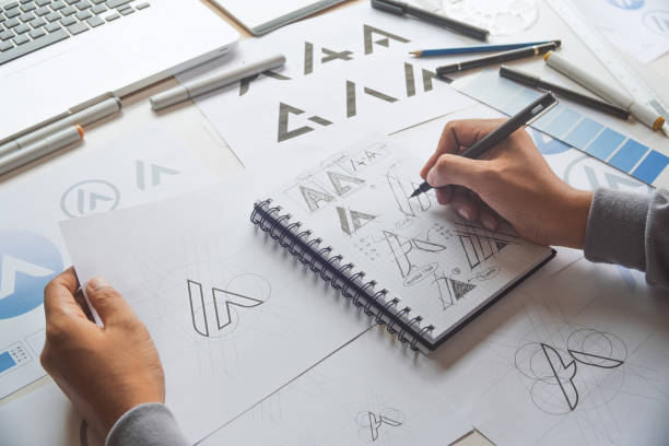 istock Graphic designer creative design sketch drawing logo Trademark brand Workspace 1264505775