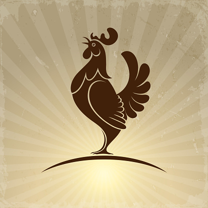 rooster symbol on a background of sunrise rays