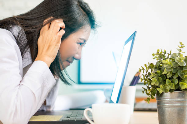 istock Beautiful female woman work office with technology computer effect blue light screen eyes health problem 1264512025