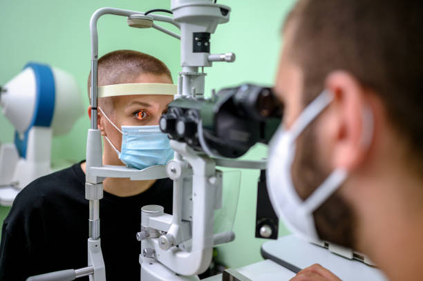istock Woman having an eye exam at ophthalmologist's office 1264515673