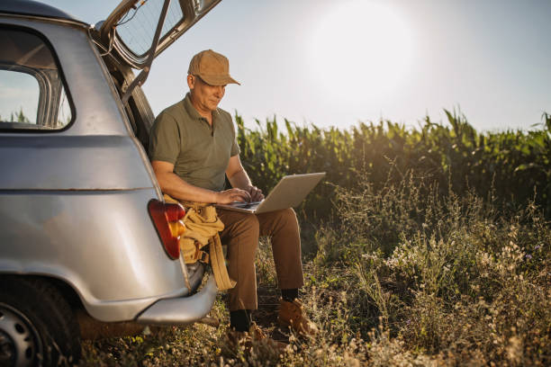 istock Mid adult farmer inspects his land 1264516902
