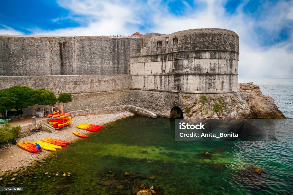Dubrovnik City Walls near the public beach Kolorina view of the Dubrovnik City Walls near the public beach Kolorina, Croatia Adriatic Sea Stock Photo