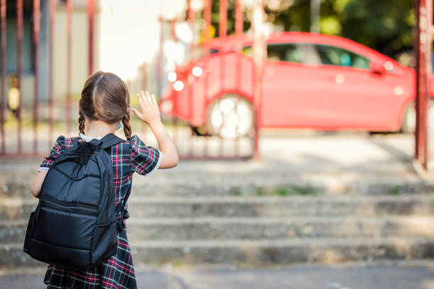 istock School girl exiting school yard 1264517181