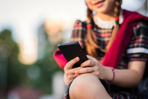 istock School girl text messaging 1264519547