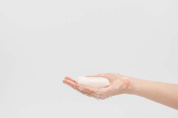 istock A soap bar in a woman's hand. Soaping hands. 1264524358