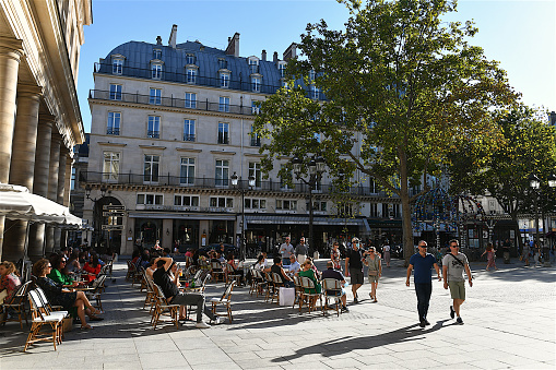 Paris, France-08 05 2020:People seated at a cafe terrace on the place Colette in Paris.The Place Colette is a square which is bordered by the Palais-Royal and the Comédie-Française.