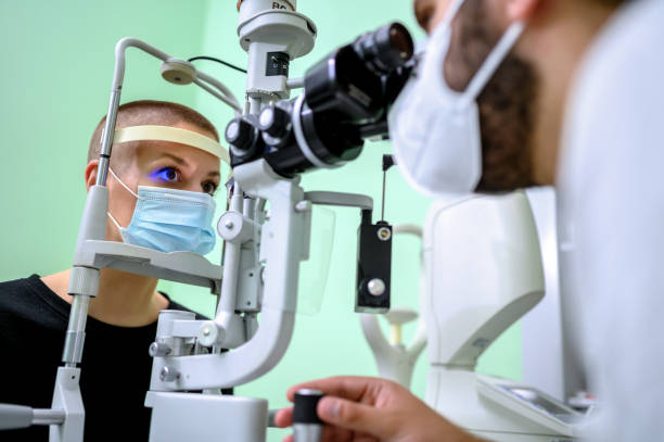 istock Woman having an eye exam at ophthalmologist's office 1264528588