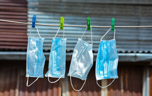 istock Clean and hang dry face masks for reusing. 1264533876