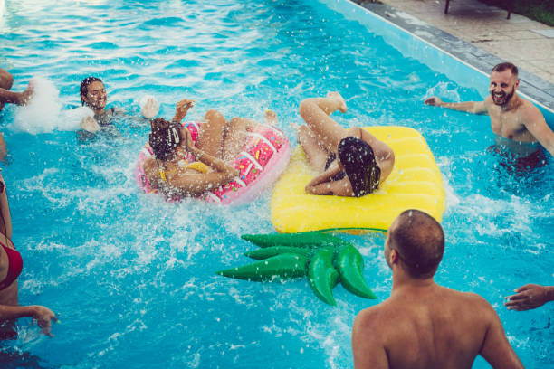 istock Friends at a poolside party 1264535215