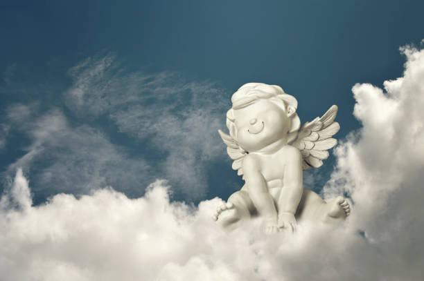 istock Guardian angel sitting on the cloud 1264536159