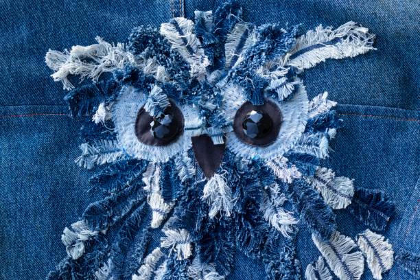 istock Blue denim jeans patchwork pattern. Concept of old jeans reuse and natural resources preserving. 1264536287