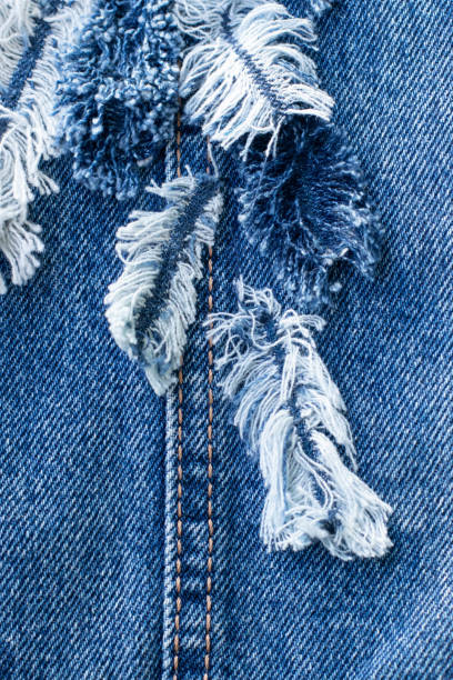 istock Blue denim jeans patchwork pattern. Concept of old jeans reuse and natural resources preserving. 1264536319