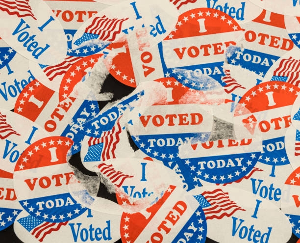 us presidential stickers and buttons after the election being removed from a window - voting imagens e fotografias de stock