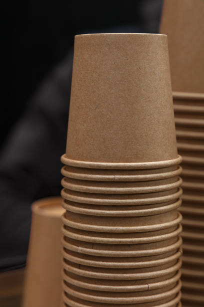 istock Stack of brown coffee paper cups close up 1264545693