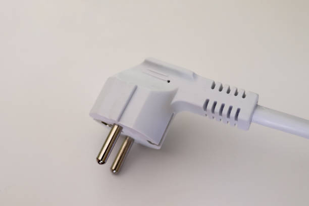 istock Isolated electrical black and white european plugs on a white background 1264547516