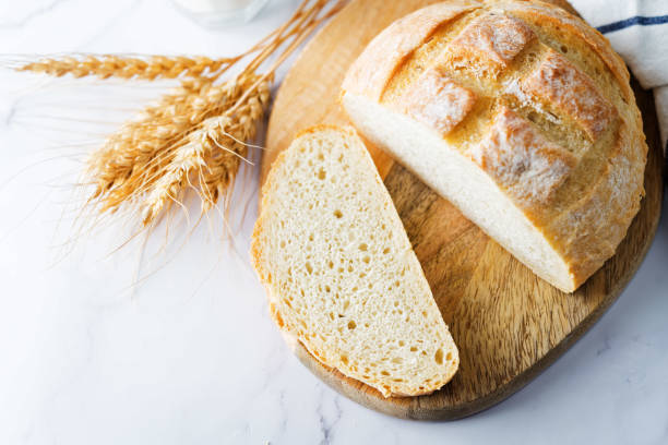 istock Wheat white bread with glasses of milk 1264548473