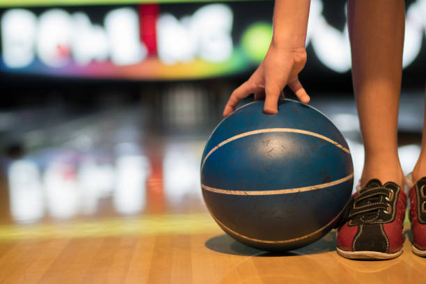 istock Close up young boy holding bowling ball 1264548703