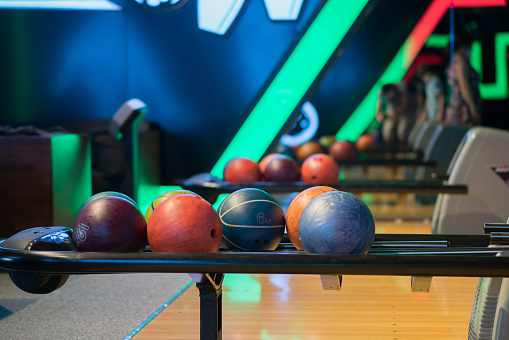 Colorful bowling balls at bowling club.