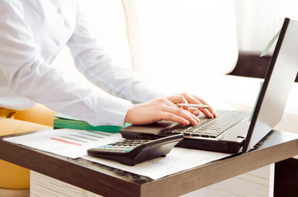 istock business woman working at home on the computer. online work 1264549481