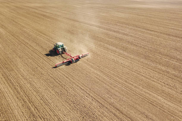 istock Aerial view Tractor preparing field, Agriculture tractor landscape 1264555821