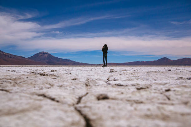 istock Woman's silhouette in a desert. 1264556655