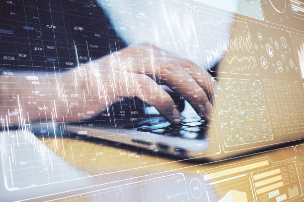 istock Businesswoman hands using laptop with glowing business chart. 1264557938