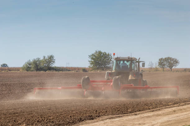 istock Tractor preparing field, Agriculture tractor 1264560401