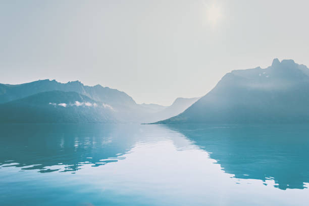 Mountains and sea mirror water reflection landscape Travel idyllic tranquil scenery Norway islands Mountains and sea mirror water reflection landscape Travel idyllic tranquil scenery Norway islands senja island photos stock pictures, royalty-free photos & images