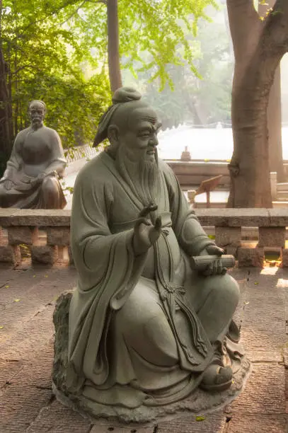 A statue of Confucius and his disciple Zigong within the Taiqing Palace Scenic Area in Qingdao China shandong province.