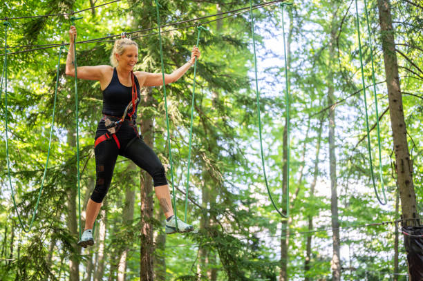 istock Rope walking at adventure park 1264565875