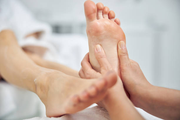 istock Woman having feet treated in spa salon 1264568218