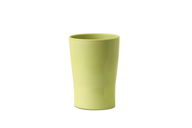 istock Plastic cup in green colour in white background 1264573568